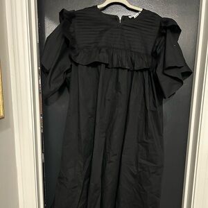 Black dress with short sleeves. New with tags. Size 2x.